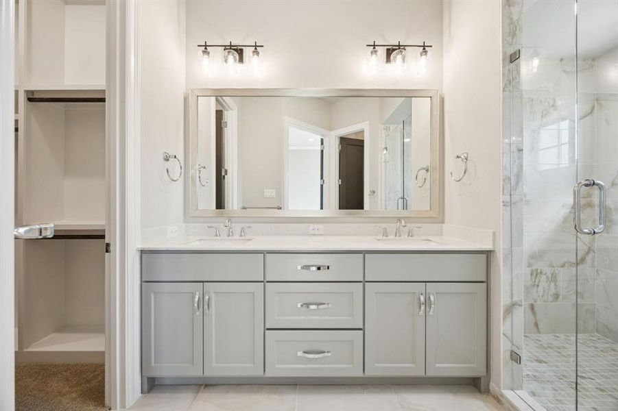 Double vanity in primary bathroom. Double vanity in primary bathroom.