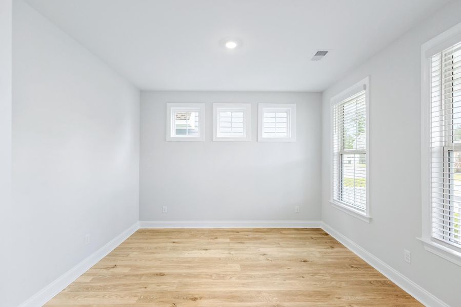 Spacious, unfurnished interior of a new home in Tidewater at Lakes of Cane Bay, Summerville (Image 27).