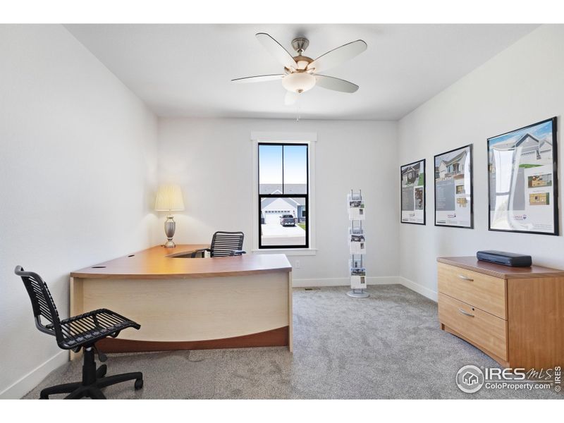 The second bedroom (at the front of the home), which acted as the marketing center in a former model home