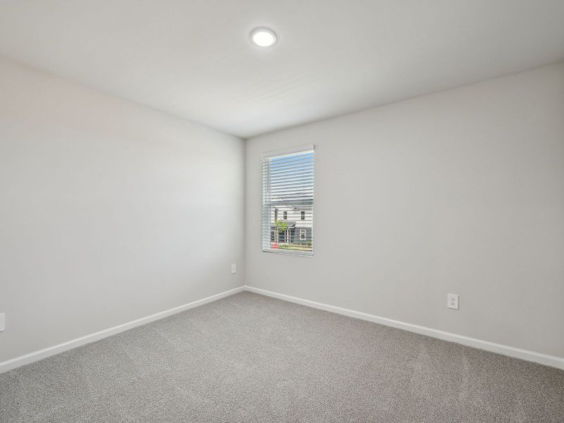 Spacious, unfurnished interior of a new home in River Glen, Angier (Image 24).