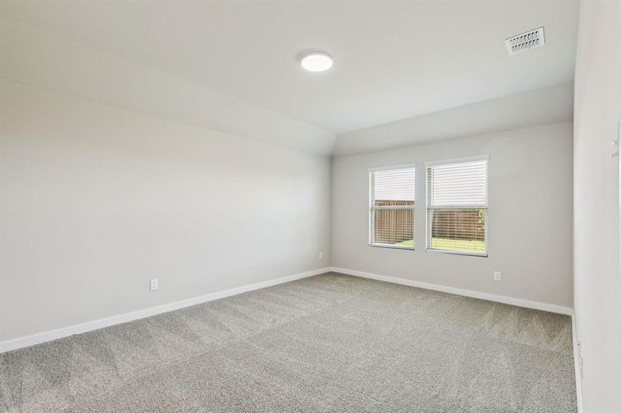 Primary Suite in the Harper home plan by Trophy Signature Homes – REPRESENTATIVE PHOTO