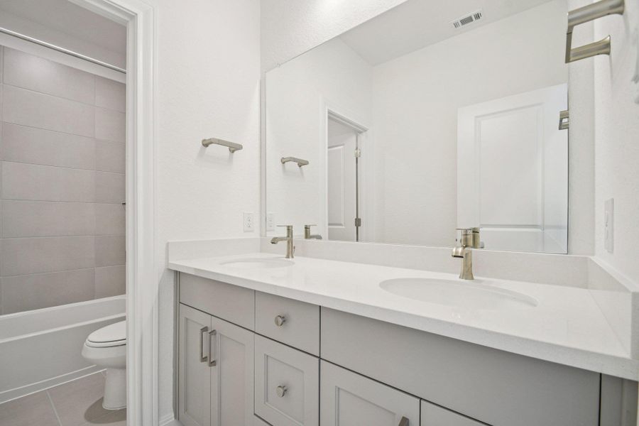 Furnished interior view inside a new home in 6 Creeks, Kyle (Image 9).