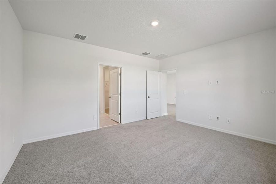 Spacious, unfurnished interior of a new home in Ridgehaven - Villas, Ormond Beach (Image 28).