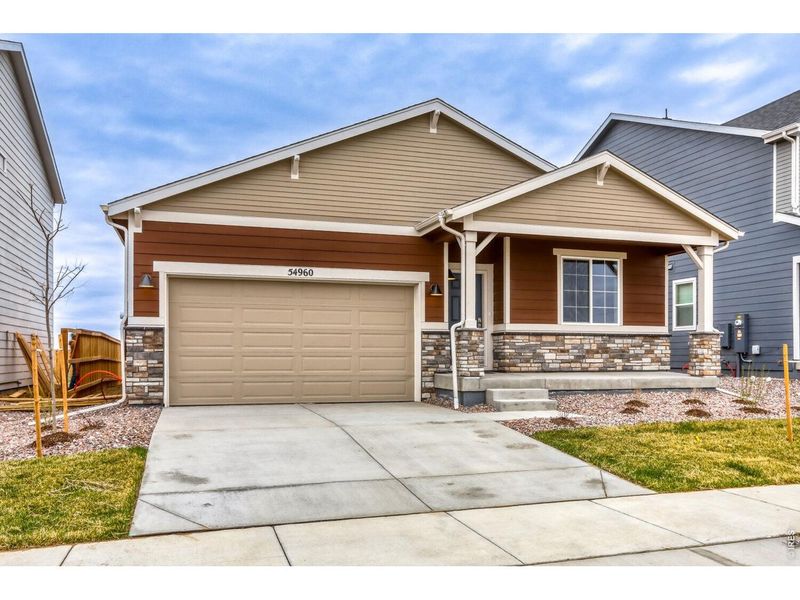 Front exterior of a new home in Farmstead, Berthoud, CO, highlighting curb appeal (Image 2). Front exterior of a new home in Farmstead, Berthoud, CO, highlighting curb appeal (Image 2).