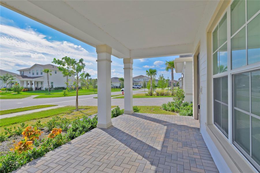 Exterior details and patio area of a home in Arden: The Waterford Collection, Loxahatchee (Image 31).