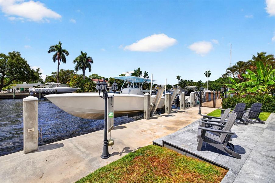New concrete dock and seawall with 20k electric boat lift, 50 amp electric and water in dock pedestal, fish cleaning station and dock ladder