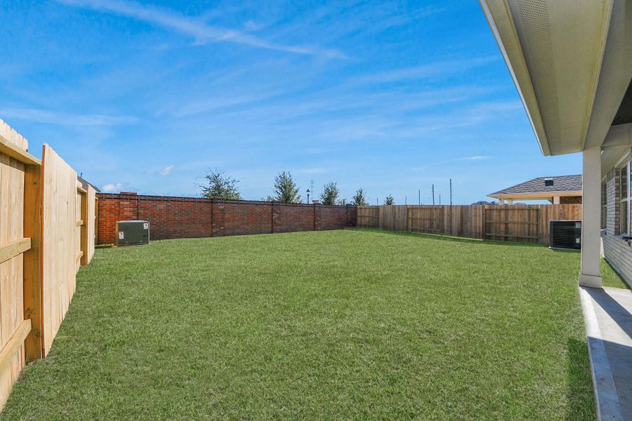 Exterior details and patio area of a home in Sunterra: Landmark Collection, Katy (Image 2).
