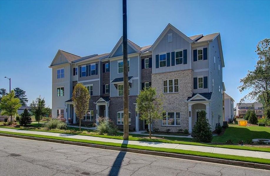 Front exterior of a new home in Townes at South Main, Kennesaw, GA, highlighting curb appeal (Image 22).