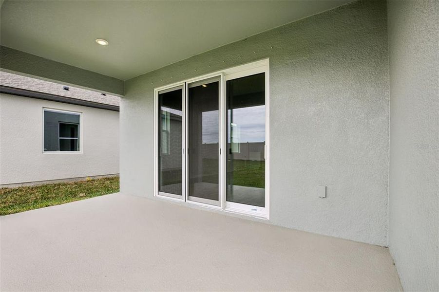 Exterior details and patio area of a home in Oakfield Trails, Parrish (Image 11).