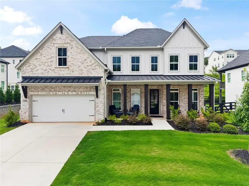 Front exterior of a new home in , Woodstock, GA, highlighting curb appeal (Image 1). Front exterior of a new home in , Woodstock, GA, highlighting curb appeal (Image 1).
