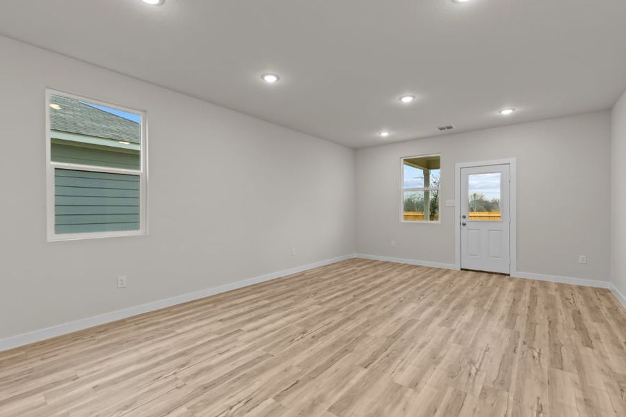 A room with a wood floor and a wood floor.