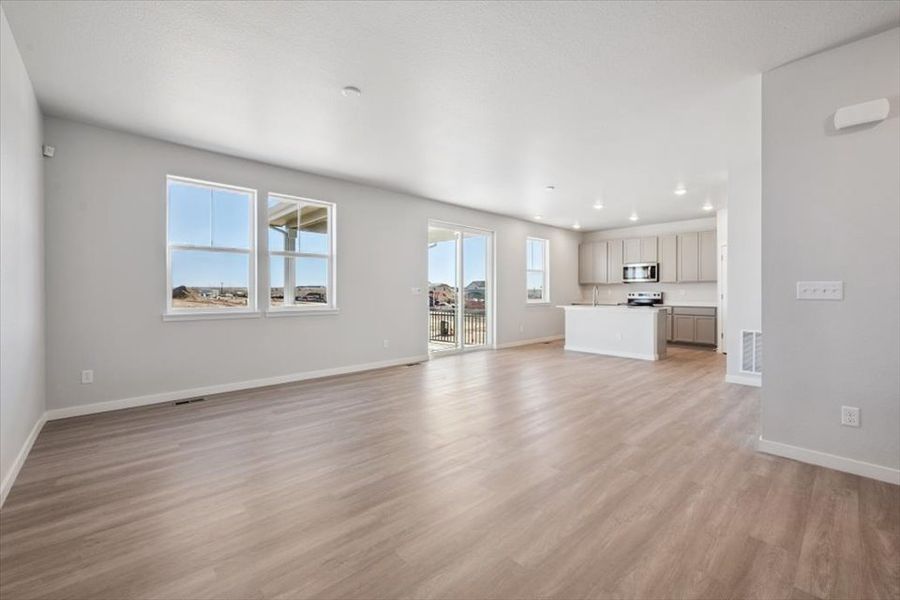 A large empty living room. A large empty living room.