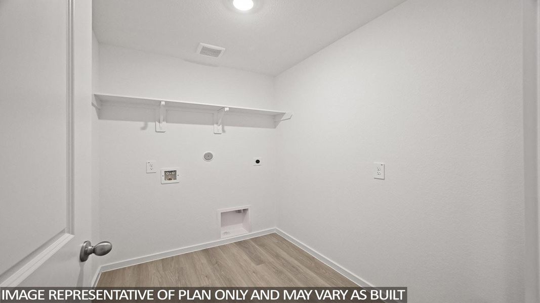 Laundry room with light wood-style flooring, hookup for an electric dryer, washer hookup, and hookup for a gas dryer