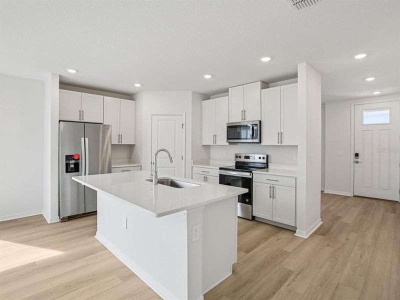 Furnished interior view inside a new home in The Grove at Stuart Crossing - Classic Series, Bartow (Image 4).