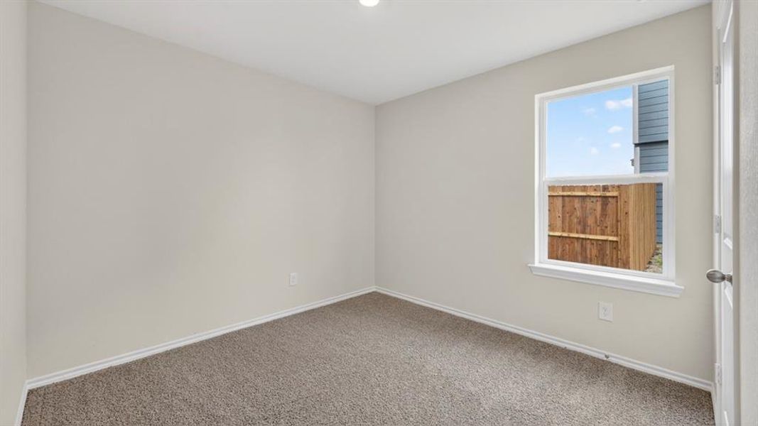 Interior room featuring light gray walls, white trim, and a single window with a white frame