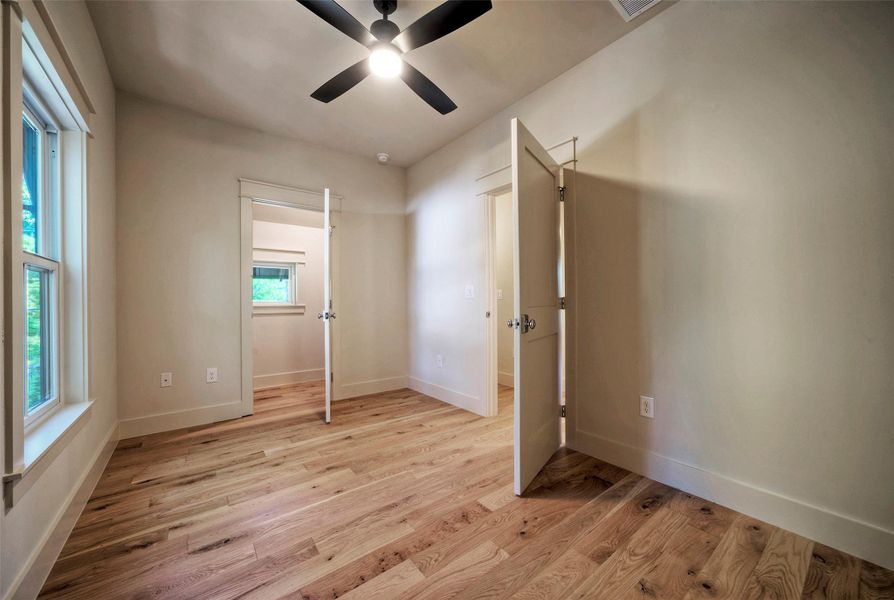 Bedroom #2 with lots of natural light and hardwood floors