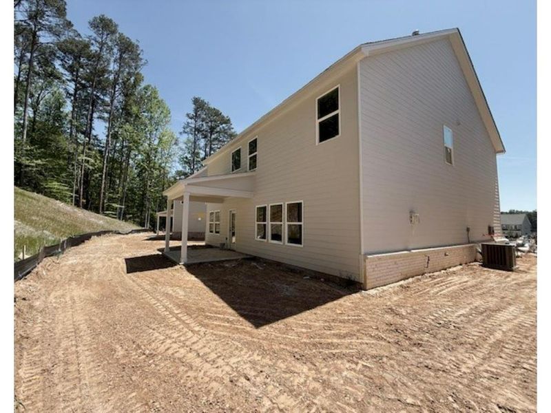 Exterior details and patio area of a home in Arbors at Richland Creek, Buford (Image 8).