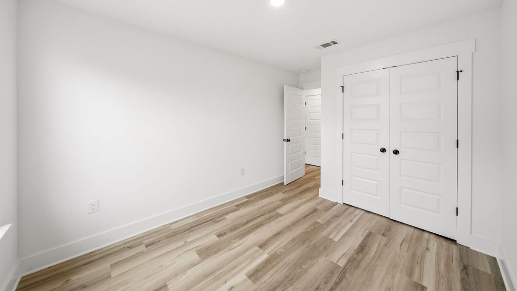 Representative unfurnished interior of a home built from the Palm Interior by D.R. Horton in Palm Street Townhomes, Destin (Image 24).