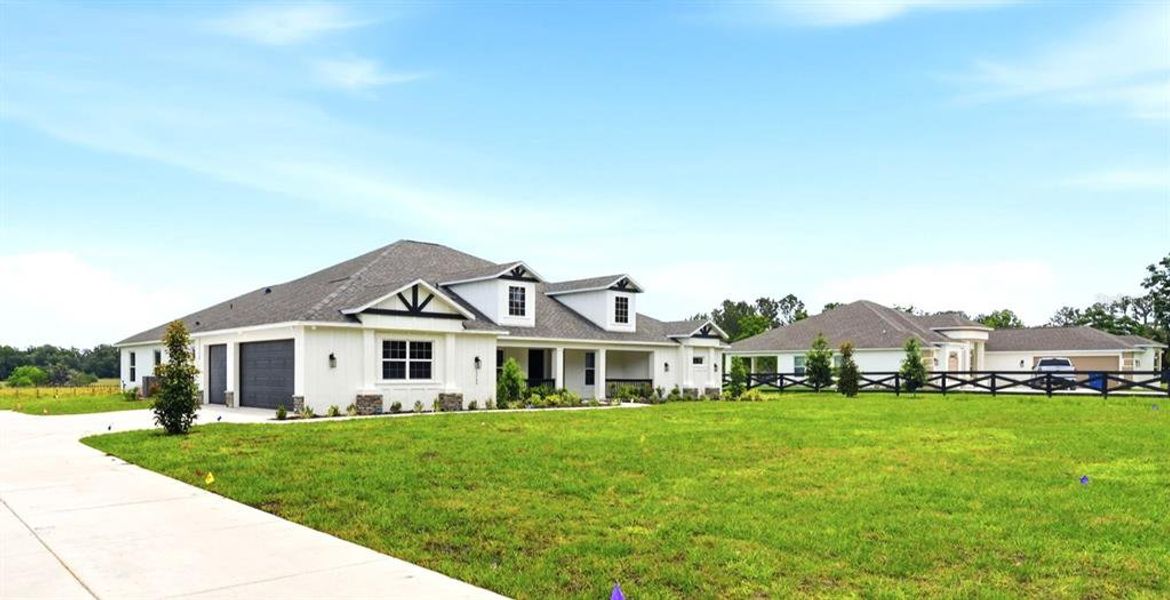 Front exterior of a new home in , Brooksville, FL, highlighting curb appeal (Image 27).