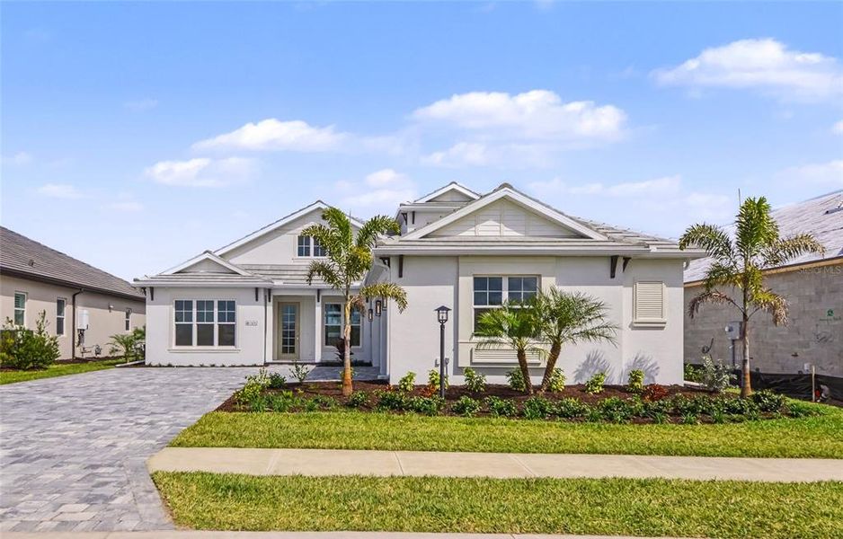 Front exterior of a new home in , Sarasota, FL, highlighting curb appeal (Image 27).