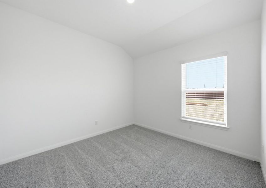 Carpeted secondary bedroom featuring a window with natural light. Carpeted secondary bedroom featuring a window with natural light.