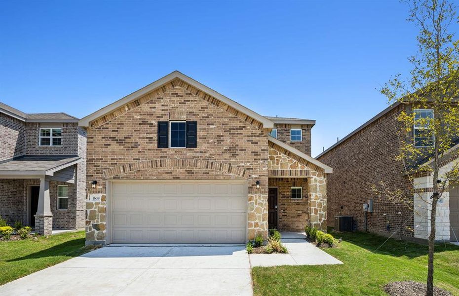 NEW CONSTRUCTION: Beautiful two-story home available at Travis Ranch in Forney