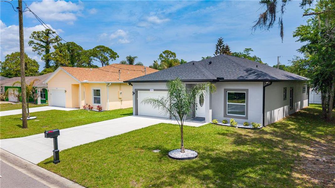 Front exterior of a new home in , Daytona Beach, FL, highlighting curb appeal (Image 22).