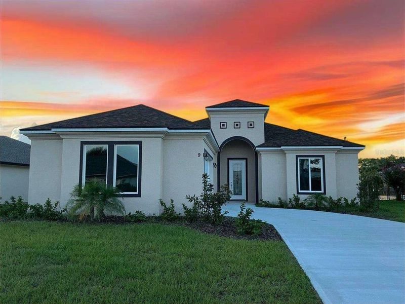 Front exterior of a new home in , Palm Coast, FL, highlighting curb appeal (Image 1). Front exterior of a new home in , Palm Coast, FL, highlighting curb appeal (Image 1).