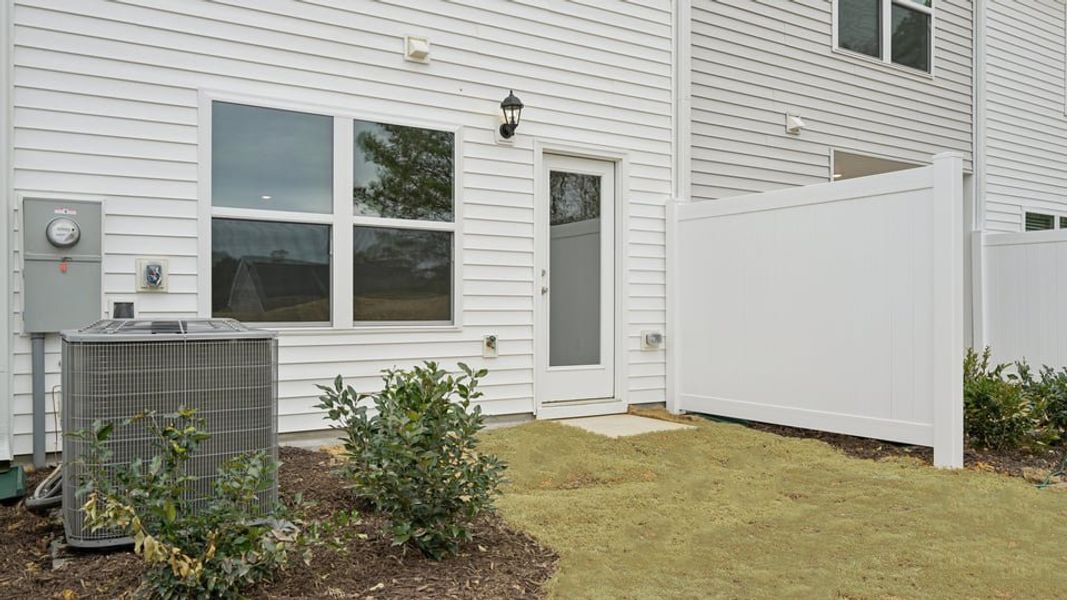 Exterior details and patio area of a home in Thornton Townes, Raleigh (Image 2). Exterior details and patio area of a home in Thornton Townes, Raleigh (Image 2).
