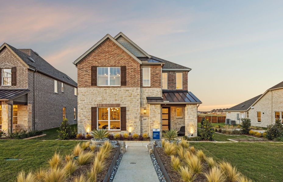 Front exterior of a new home in Pinnacle at Legacy Hills, Celina, TX, highlighting curb appeal (Image 1). Front exterior of a new home in Pinnacle at Legacy Hills, Celina, TX, highlighting curb appeal (Image 1).