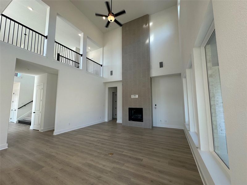 Family Room with soaring ceiling & fireplace