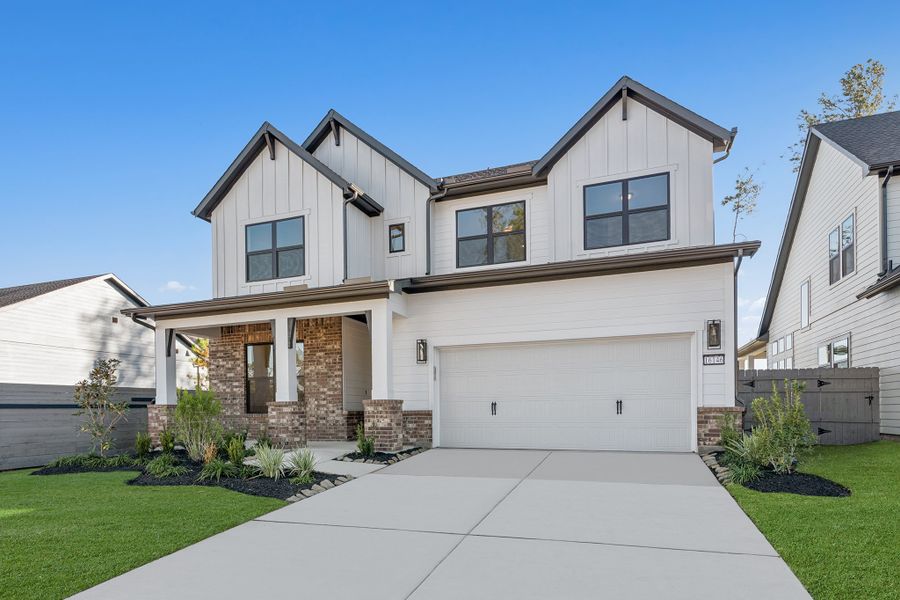Front exterior of a new home in ARTAVIA - Enclave Collection, Conroe, TX, highlighting curb appeal (Image 26).