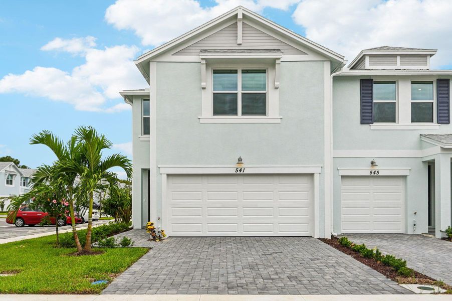 Front exterior of a new home in Tidewater, Fort Pierce, FL, highlighting curb appeal (Image 18). Front exterior of a new home in Tidewater, Fort Pierce, FL, highlighting curb appeal (Image 18).