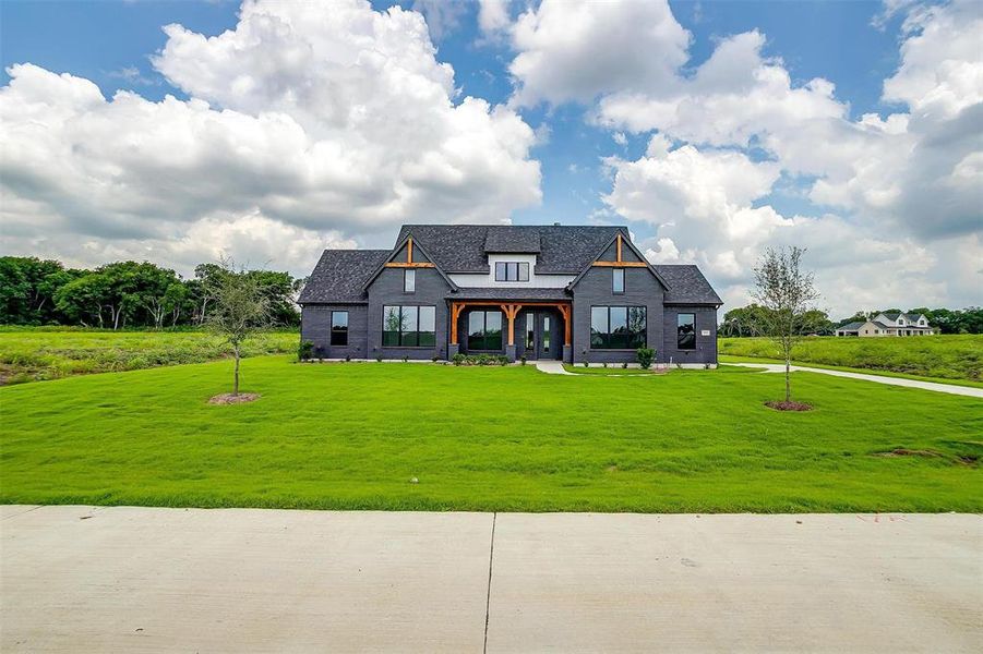 View of front of property with a front lawn