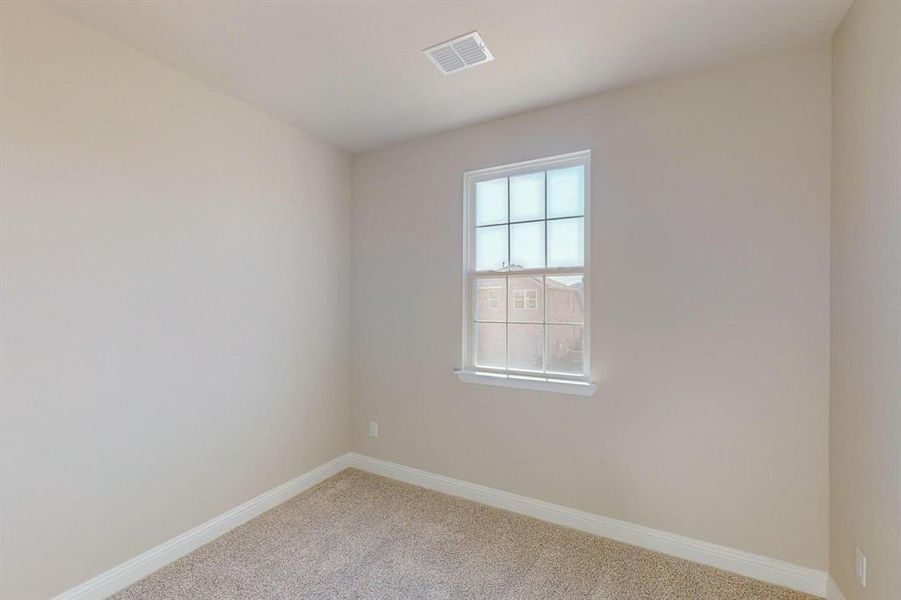 Spare room with carpet flooring