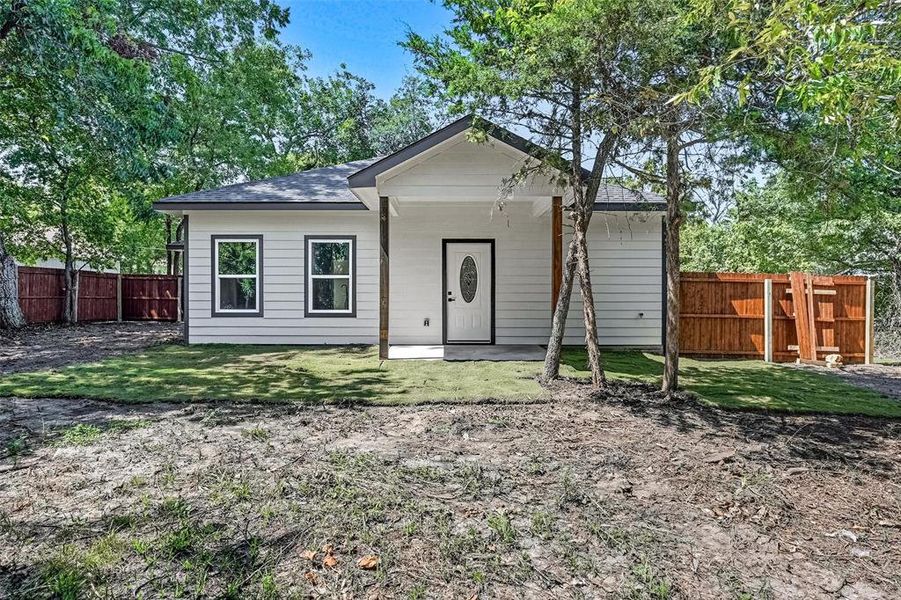 Back of house featuring roof with shingles Back of house featuring roof with shingles