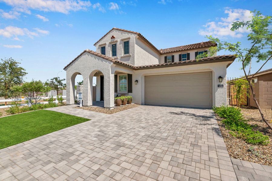 Front exterior of a new home in Icon at Thunderbird, Glendale, AZ, highlighting curb appeal (Image 25). Front exterior of a new home in Icon at Thunderbird, Glendale, AZ, highlighting curb appeal (Image 25).