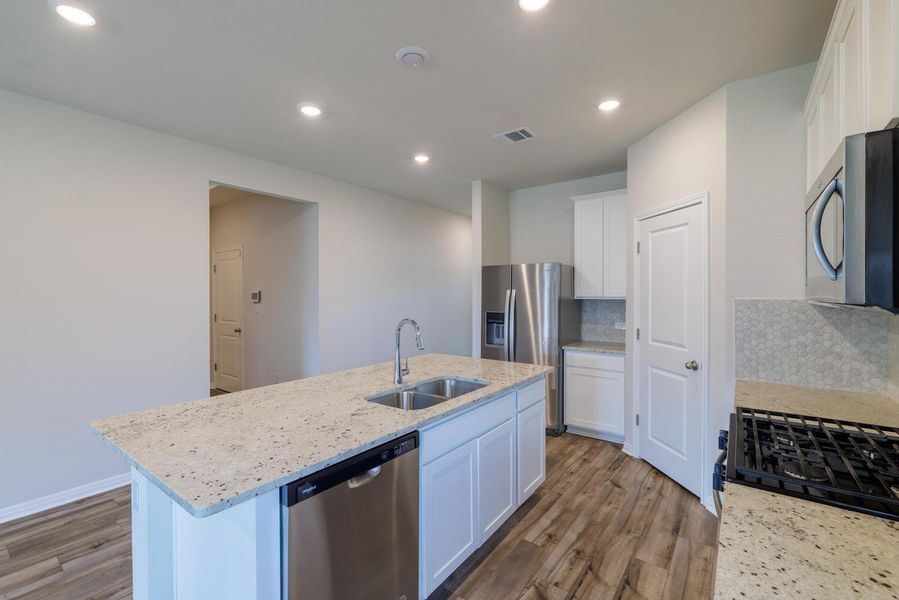 Furnished interior view inside a new home in , Manor (Image 18).