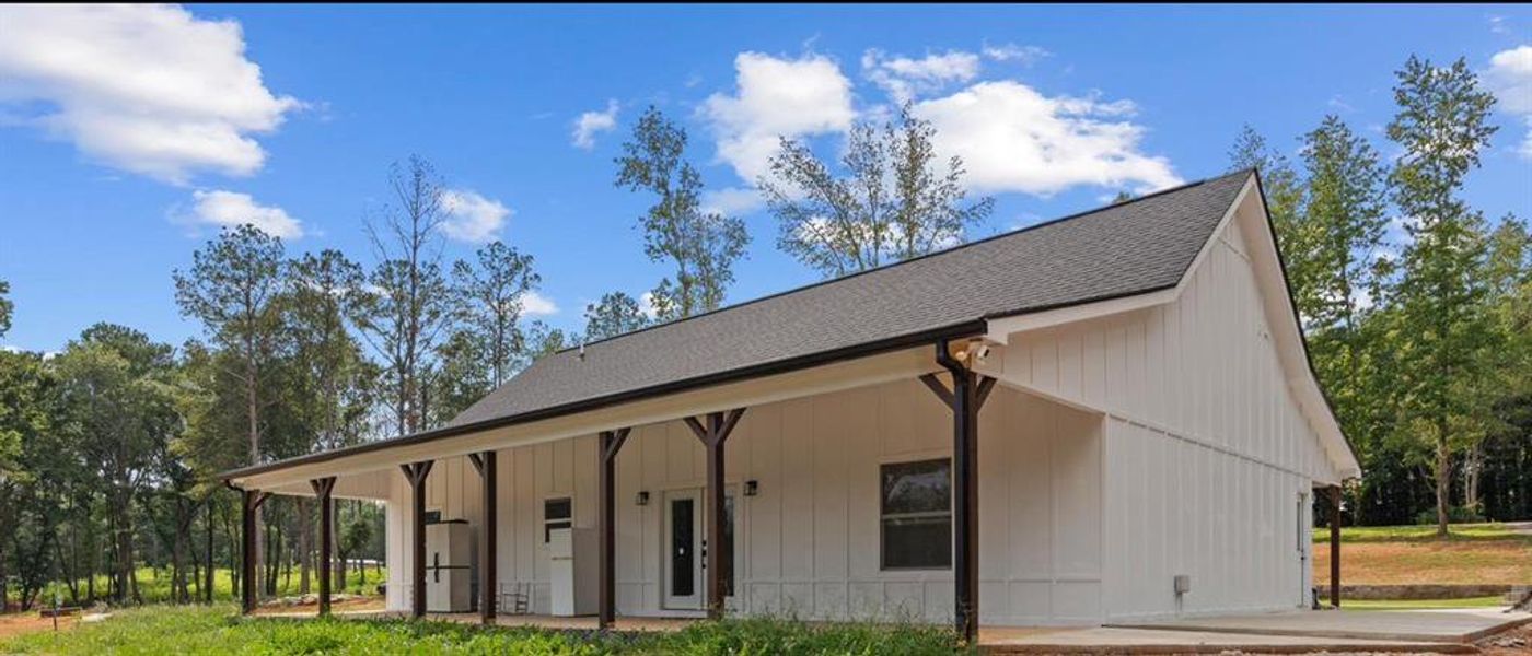 Front exterior of a new home in , Carrollton, GA, highlighting curb appeal (Image 21).