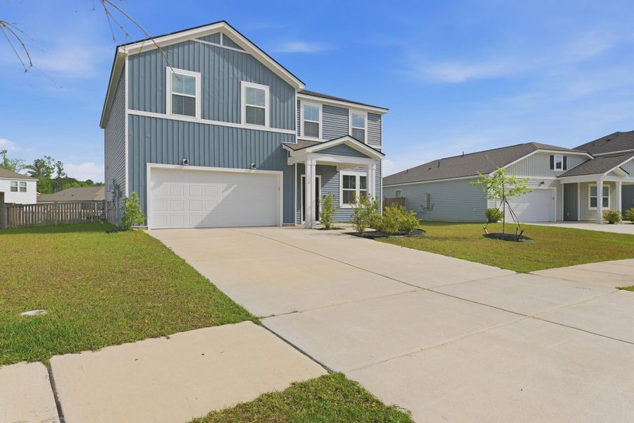 Front exterior of a new home in Bradford Pointe, Summerville, SC, highlighting curb appeal (Image 20).