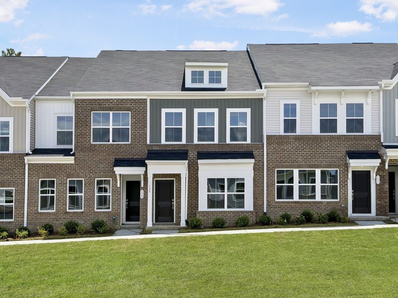 Front exterior of a new home in Renaissance at White Oak, Garner, NC, highlighting curb appeal (Image 1). Front exterior of a new home in Renaissance at White Oak, Garner, NC, highlighting curb appeal (Image 1).