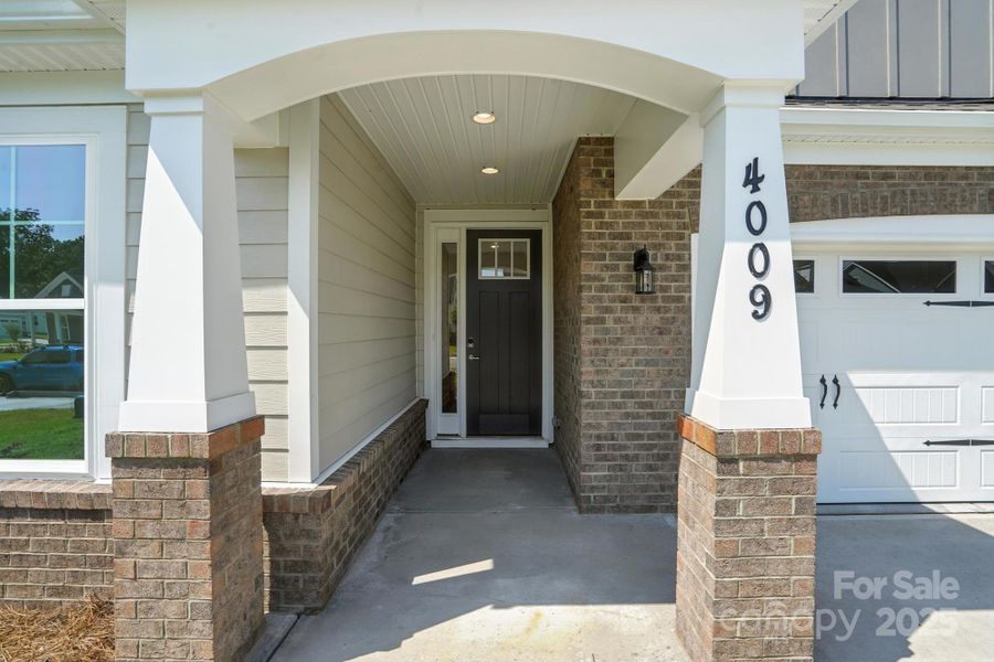 Front exterior of a new home in Heritage - 55+ Community, Indian Trail, NC, highlighting curb appeal (Image 20).