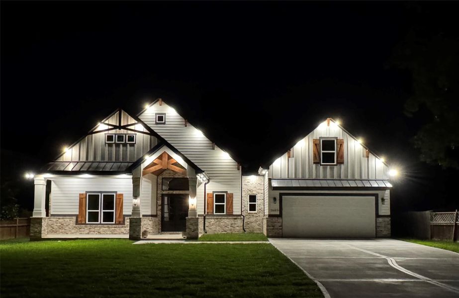 Beautiful Evening Exterior with Under Mount Lighting that Showcases Your New Home.