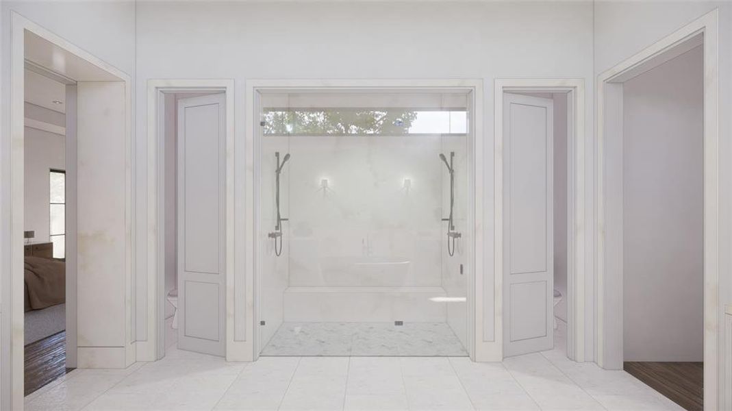 Spacious glass shower with marble finishes