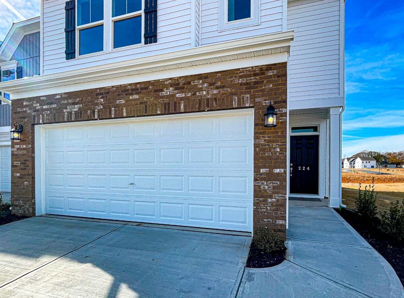 Front exterior of a new home in Bellevue Townhomes, Greenville, SC, highlighting curb appeal (Image 2).