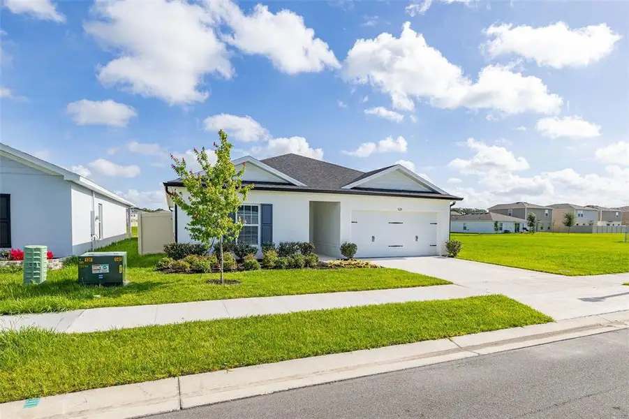 Front exterior of a new home in , Sumterville, FL, highlighting curb appeal (Image 22).