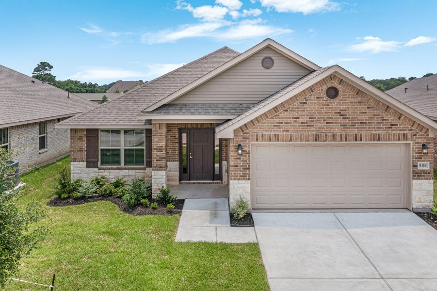 Front exterior of a new home in Bayou Maison, Dickinson, TX, highlighting curb appeal (Image 1).