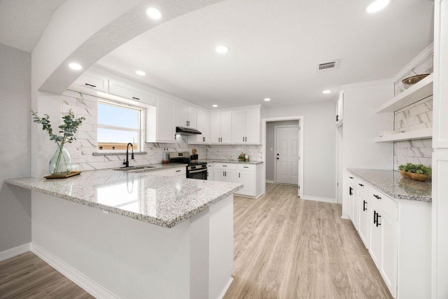 The sleek countertops and modern cabinetry provide ample workspace, making this the ideal hub for both daily meal preparation and hosting guests. The thoughtful layout ensures that the kitchen remains both fuThis gourmet kitchen features a spacious breakfast bar perfect for casual dining or additional seating, seamlessly integrating into the open-concept living area.nctional and stylish, serving as the heart of the home. The sleek countertops and modern cabinetry provide ample workspace, making this the ideal hub for both daily meal preparation and hosting guests. The thoughtful layout ensures that the kitchen remains both fuThis gourmet kitchen features a spacious breakfast bar perfect for casual dining or additional seating, seamlessly integrating into the open-concept living area.nctional and stylish, serving as the heart of the home.