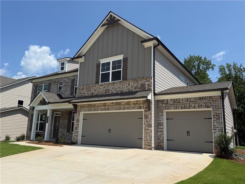 Front exterior of a new home in Ponderosa Farms Manor, Gainesville, GA, highlighting curb appeal (Image 28). Front exterior of a new home in Ponderosa Farms Manor, Gainesville, GA, highlighting curb appeal (Image 28).