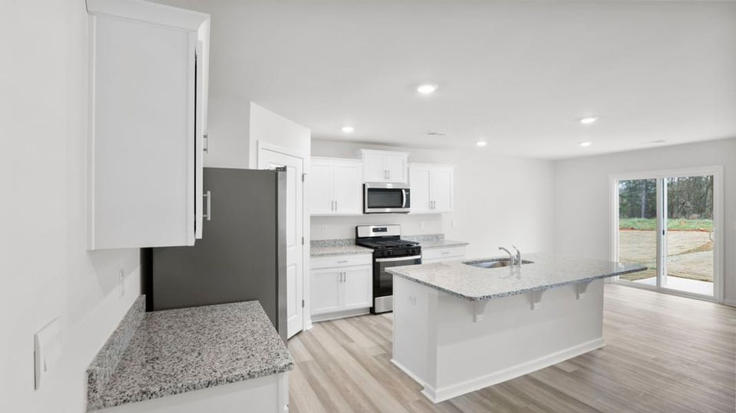 Furnished interior view inside a new home in Lakestone, Woodruff (Image 6).